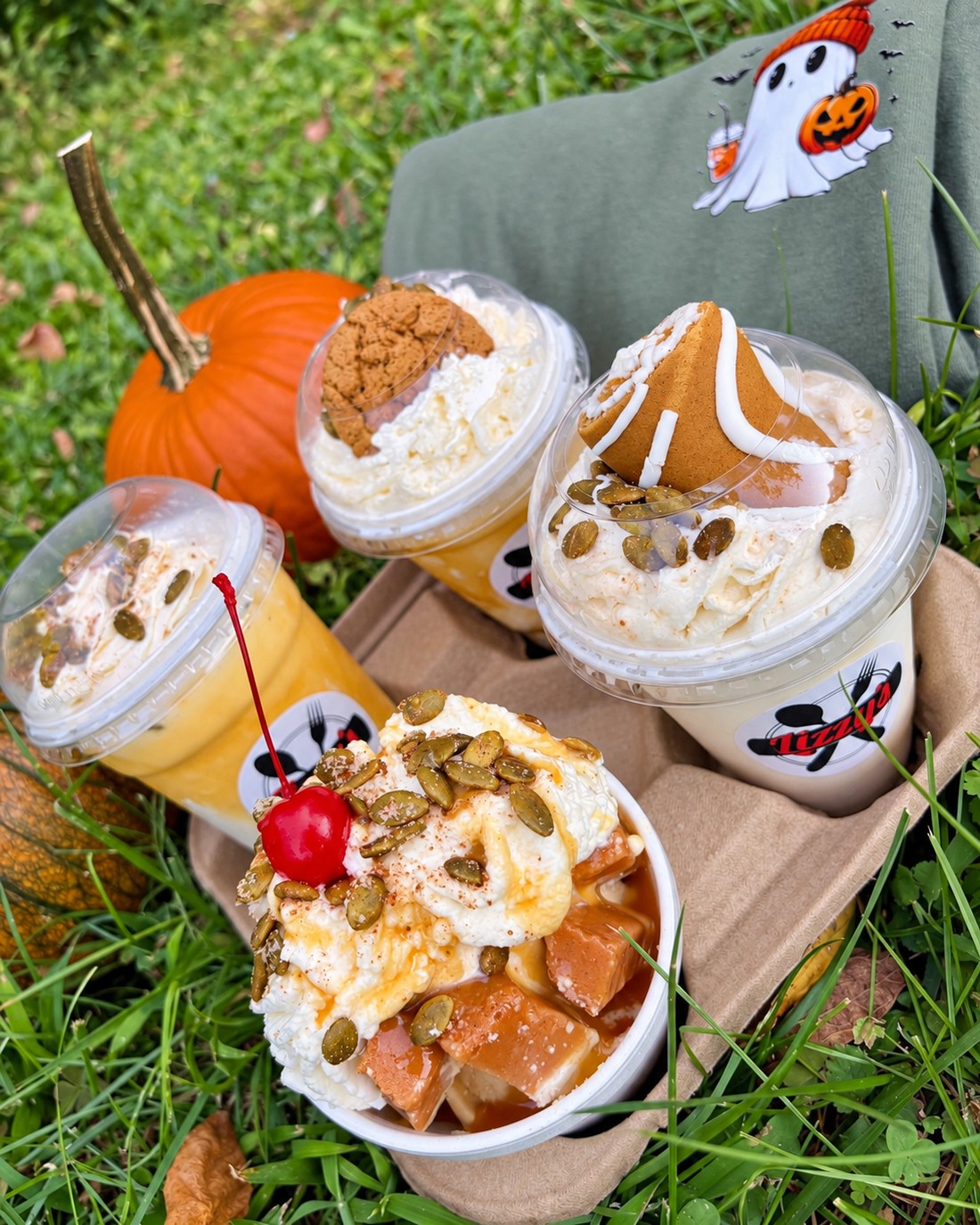 Lizzy’s fall desserts with a sundae in a foam bowl and drinks in takeaway cups