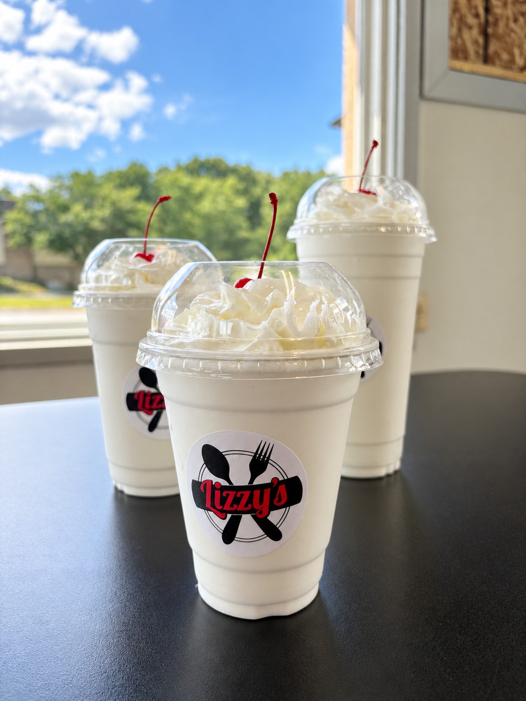 Milkshakes in branded Lizzy’s takeaway cups
